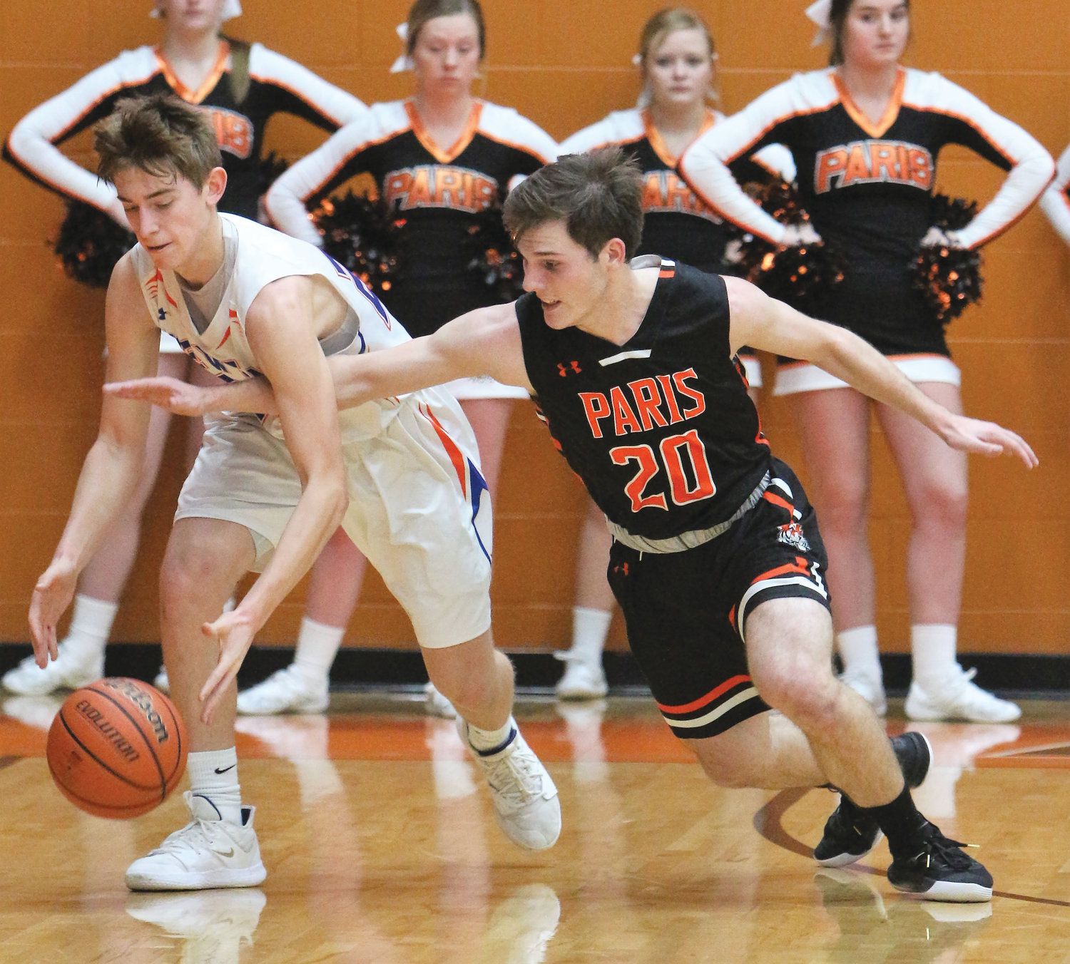 Paris Tiger Coy Landrum goes after a loose ball in Wednesday Little Illini Conference consolation matchup against the Newton Eagles. Paris fell to the Eagles 52-37 at Paris High School.